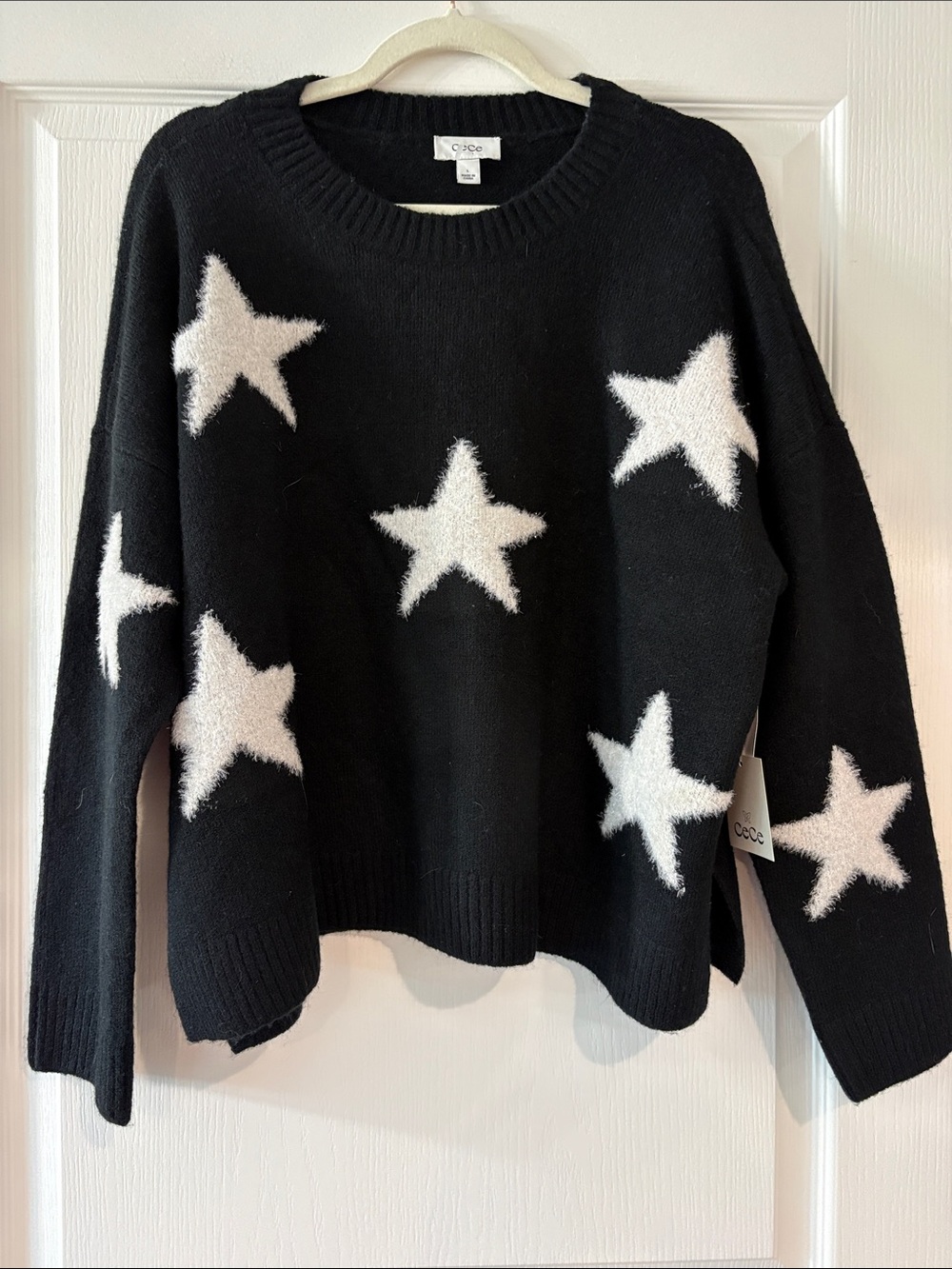 CeCe Black Sweater with White Star Accents